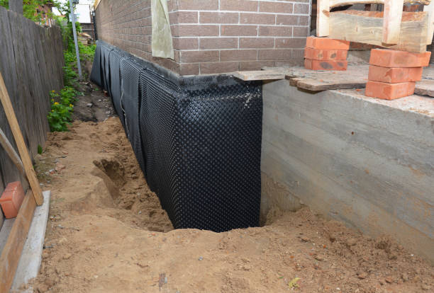 Happy homeowners after waterproofing job in Kirklin